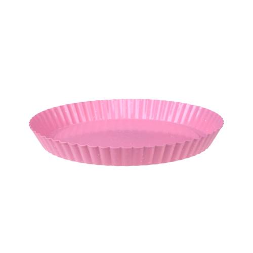 Pink fluted baking dish on a white background